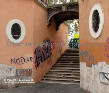 Romes graffiti-coated buildings near Ponte Sisto, the other side of Rome