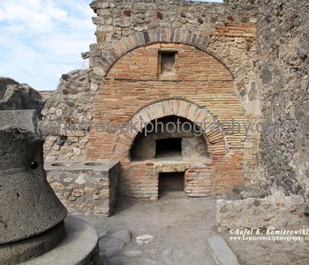 Red brick archway  at local ancient bakery, Pompeii