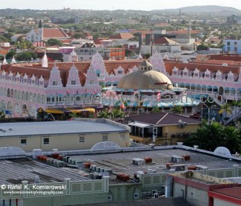 Oranjestad is the historical Dutch capital city where the tall multicolored houses of Wilheminastraat combine carved wooded doors and traditional Dutch tiles with airy open galleries and sloping, Aruban-style roofs