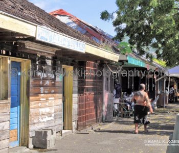 Street market is full of people from all over the island who bring their vegetables, fruits, spices and meats to sell...