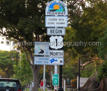 The southern end of the 2377-mile (3825 km) long U.S. Highway 1 is in Key West. The highway begins in Maine at the Canadian border and travels along the east coast of the United States. This is mile marker 0 at the southern tip of the continental U.S.