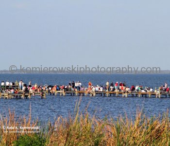 24 February, 2011 at  16:16 Eastern in Titusville. Thousands of spectators jam the pier and adjacent sandy beach to watch the shuttles go up