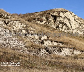 Large terrain with clay-rich soil that has been extensively eroded by wind and water viewed from Bowbend Trail (bicycle path),  Glenbow Ranch Provincial Park