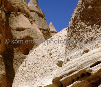 The volcanically-formed sentinels of Tent Rocks, composed of pumice, ash, and tuff deposits, range from just a few feet tall to nearly 100 feet (30 m) in height