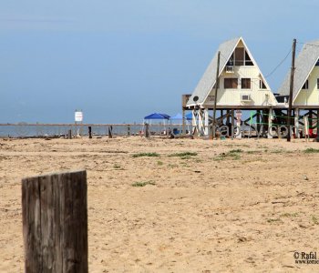 Homes atop tall concrete or wooden stilts. They are built to withstand hurricane winds as well as the most severe flooding...