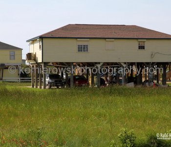 Homes atop tall concrete or wooden stilts. They are built to withstand hurricane winds as well as the most severe flooding
