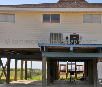 Homes atop tall concrete or wooden stilts. They are built to withstand hurricane winds as well as the most severe flooding