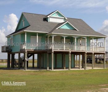 Homes atop tall concrete or wooden stilts. They are built to withstand hurricane winds as well as the most severe flooding