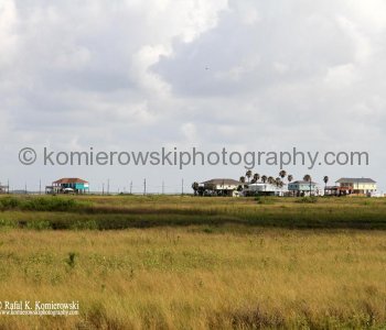 Homes atop tall concrete or wooden stilts. They are built to withstand hurricane winds as well as the most severe flooding