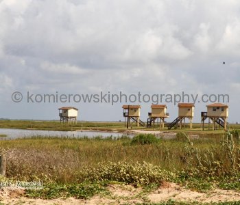 Homes atop tall concrete or wooden stilts. They are built to withstand hurricane winds as well as the most severe flooding