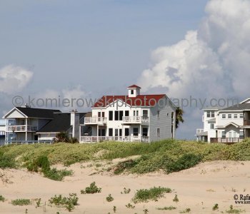 Homes atop tall concrete or wooden stilts. They are built to withstand hurricane winds as well as the most severe flooding