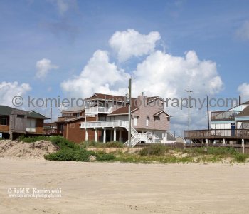 Homes atop tall concrete or wooden stilts. They are built to withstand hurricane winds as well as the most severe flooding