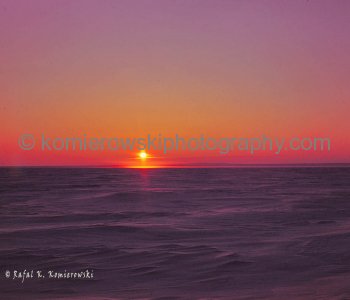Canadian Arctic, Massey Sound, April 18, 1975, -43C.  First Sun above horizon line/ice (April 18) to be visible for a continuous 24 hours during Arctic Spring and Summer Months. Massey Sound between Haig-Thomas Island, Amund Rignes Island and Axel Heiber