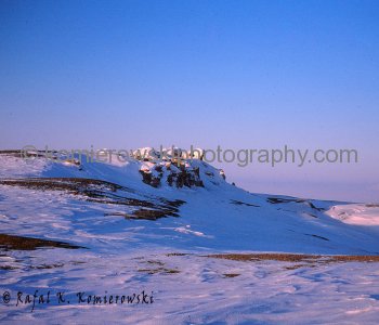 Canadian Arctic, Midnight at Belcher Island, April 1975, -48C.  Surveying on the top of Belcher Island at Midnight Hour. On horizon view of Graham Island.