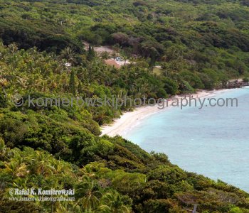 Lifou.....many limestone caves and  white beaches with coral reefs are teeming with brightly coloured marine... life
