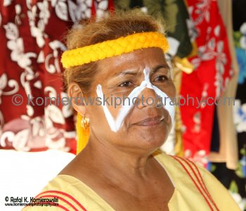 Local woman at a small market at the top of the rise to the left from the tender wharf...