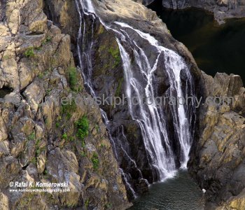 Barron Falls is where the Barron River makes its descent from the Atherton Tablelands to the Cairns coastal plain, in Queensland, Australia. (Wikipedia)